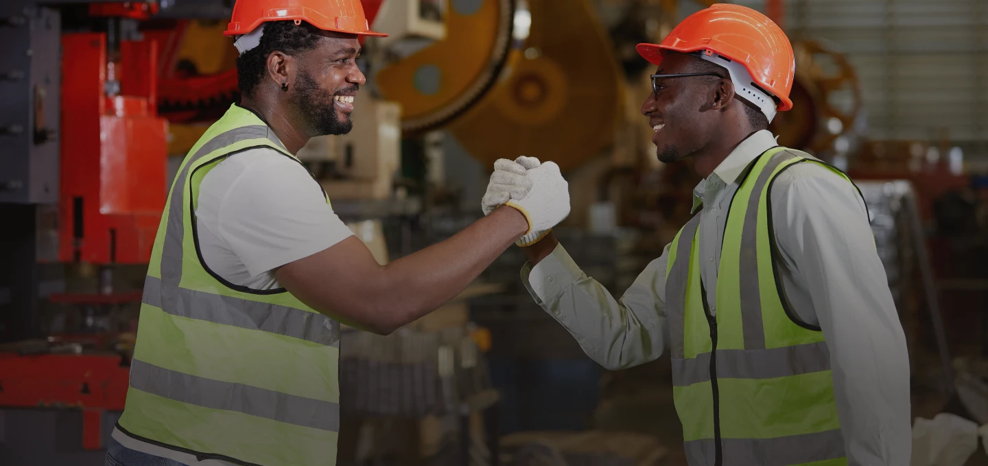 Workers in factory celebrating